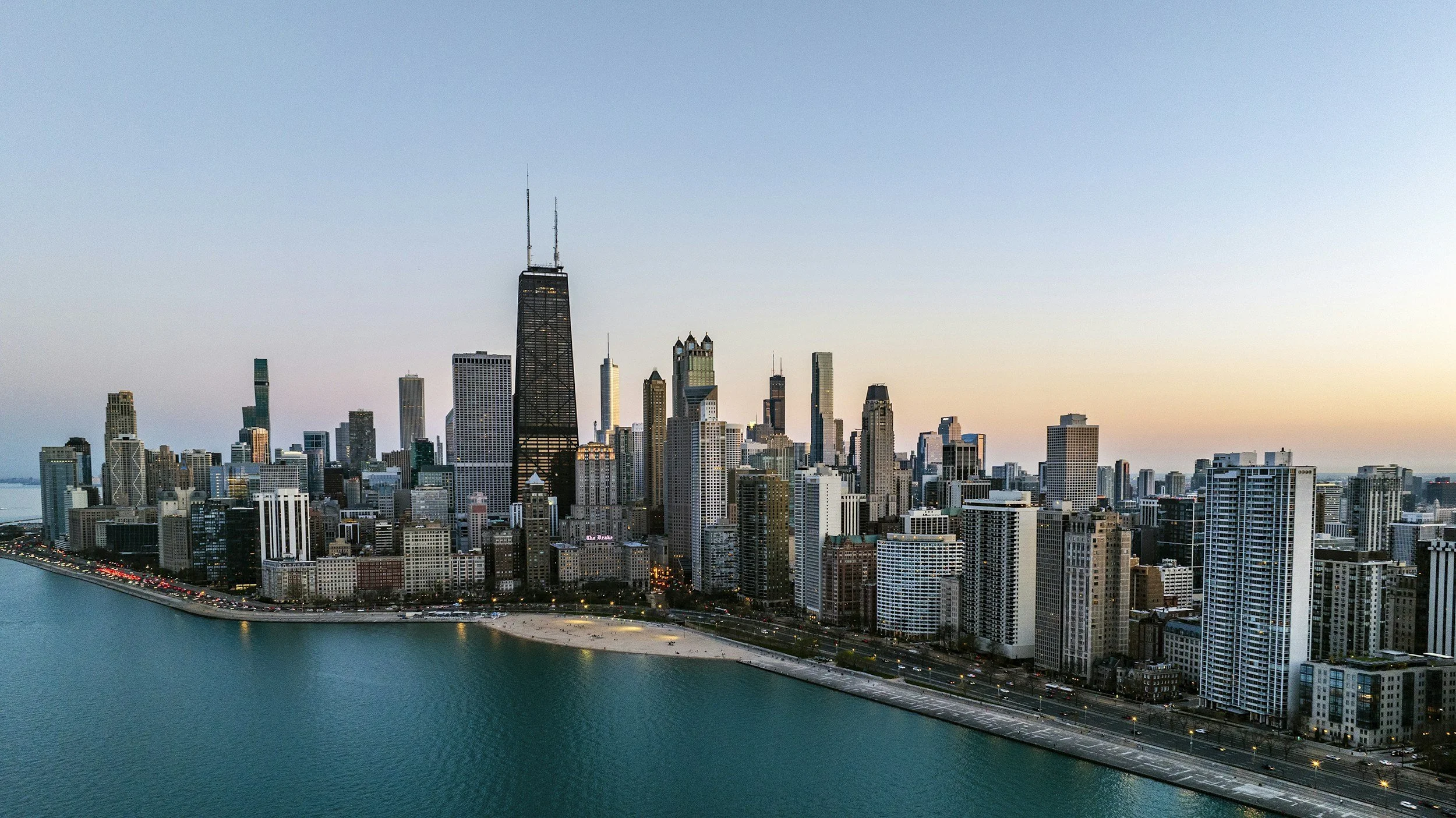 Aerial view of the Chicago skyline and lakefront at dusk