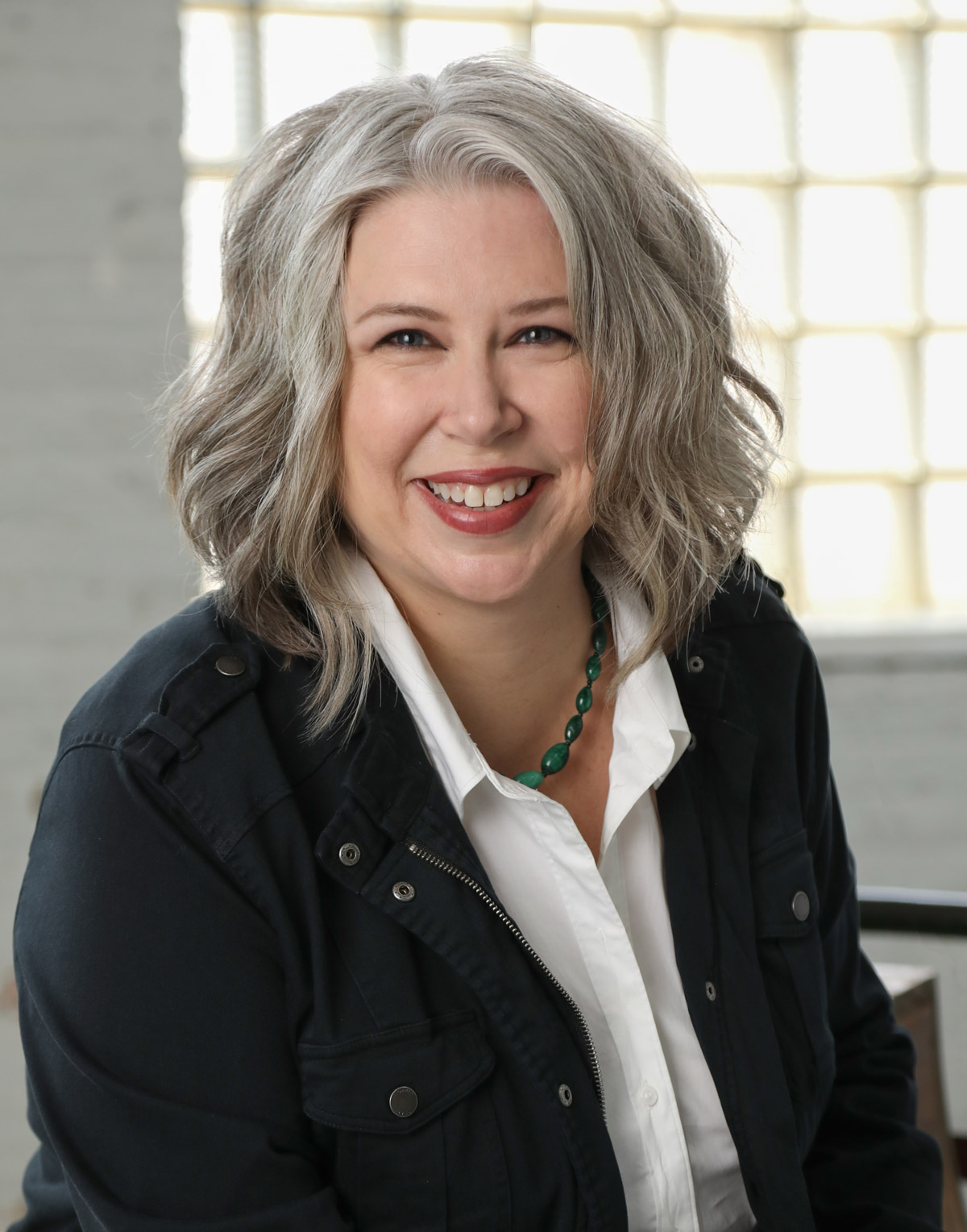 Professional headshot of Chicago real estate agent Deborah Libby.